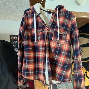 Plaid long sleeve flannel. Super warm and fuzzy on the inside.